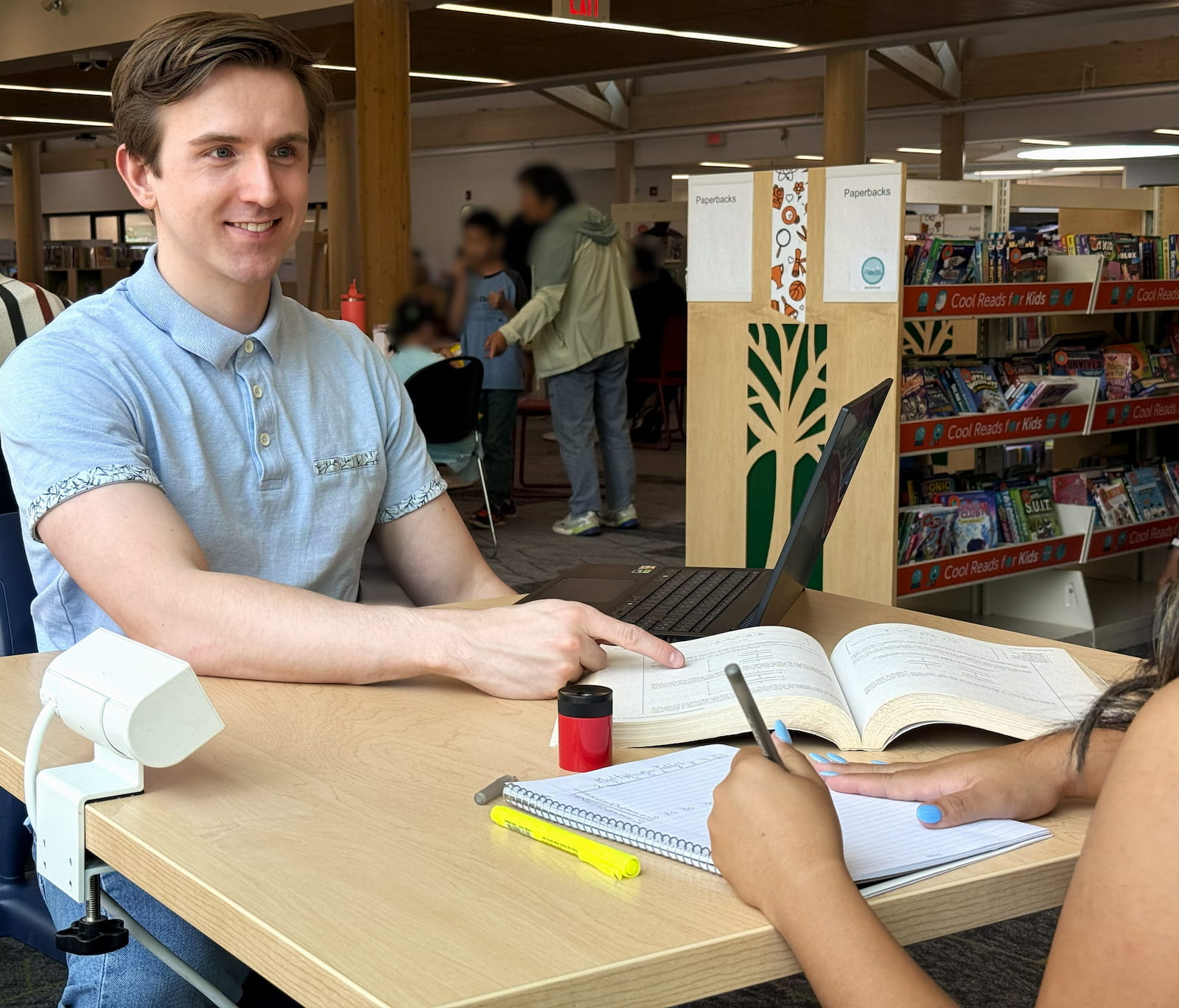 A one-on-one tutoring session at a Calgary public library